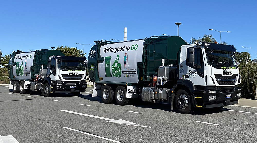 Two Solo waste management vehicles